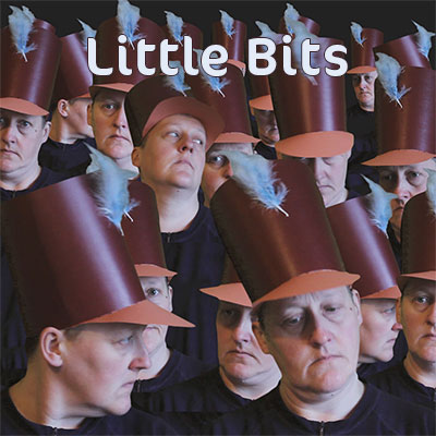 lots of women in hats made out of cardboard